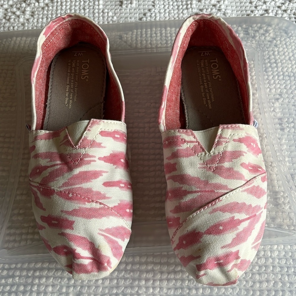 Tom’s pink and white animal print slip ons. Size 7